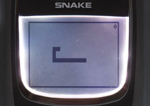 A picture of the retro snake game being played on an old Nokia device